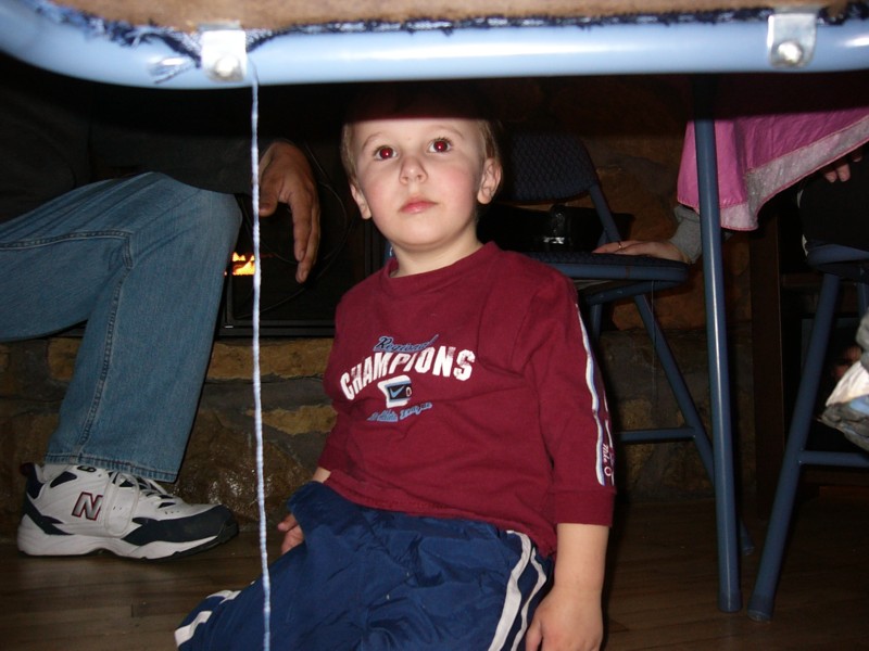 Trey under the table.JPG